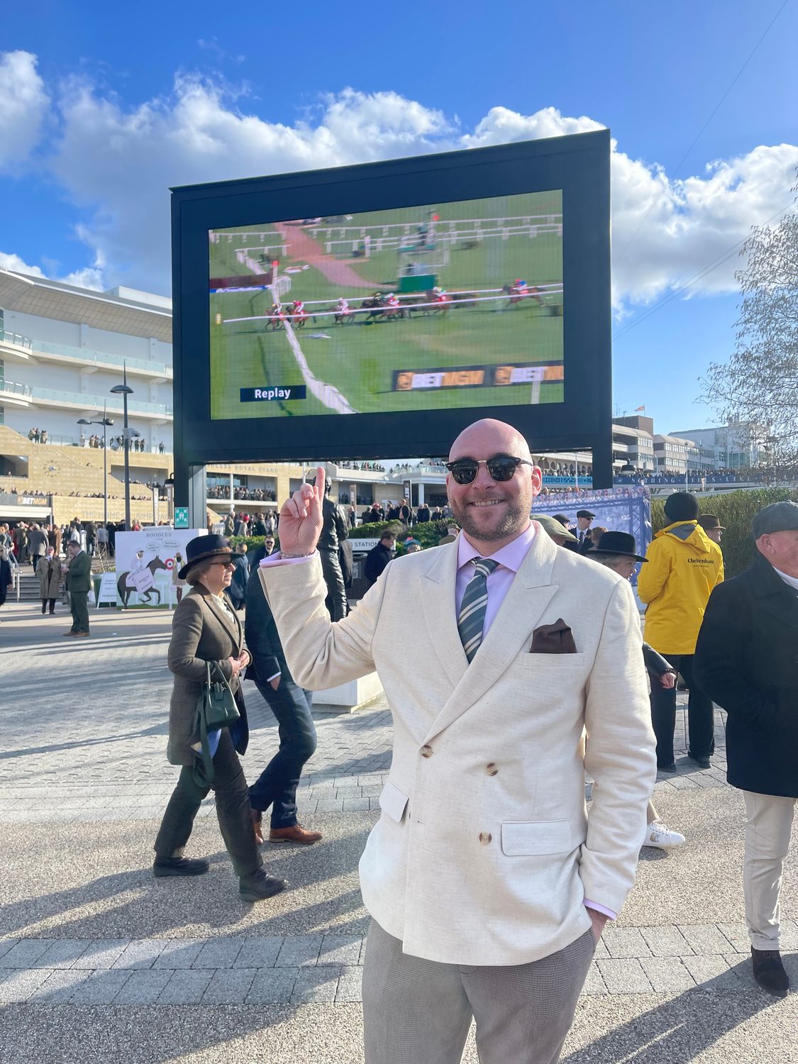Myles in front of the big screen at Cheltenham during a replay